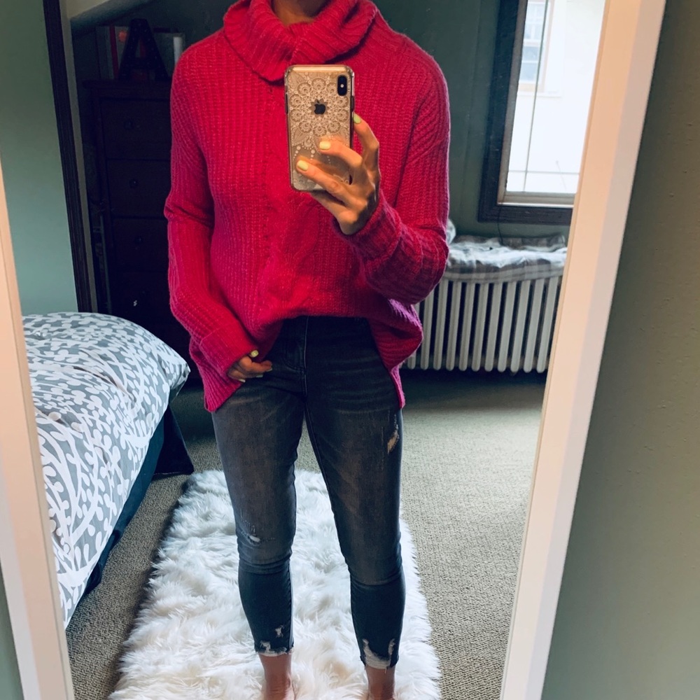 Bright pink turtleneck sweater